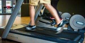 Man running on a top treadmill Ancheer brand