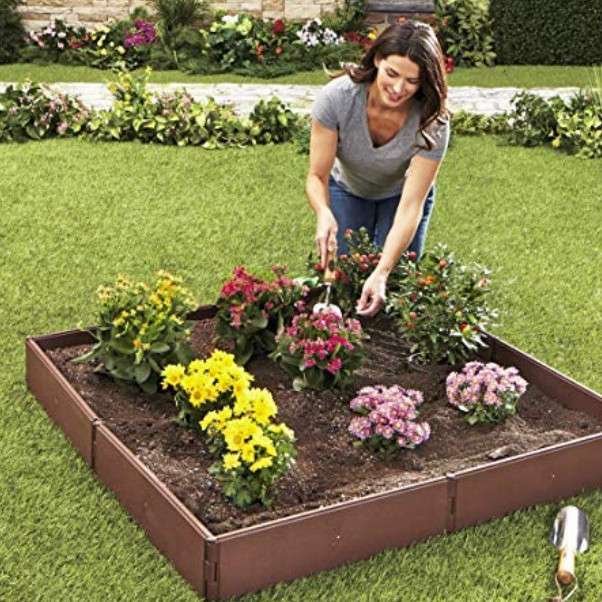 WOMEN IS GARDENING AND GETTING HER EXERCISE REQUIREMENT