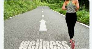 WEGOVY CHANGES YOUR LIFESTYLE. A GIRL IS WALKING ON A GRAY ROAD CALLED WITH WELLNESS PAINTED IN WHITE LETTERS