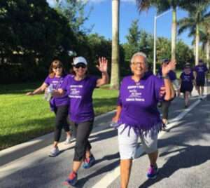 The Blue Zone Walking Team wearing purole T-shirts.