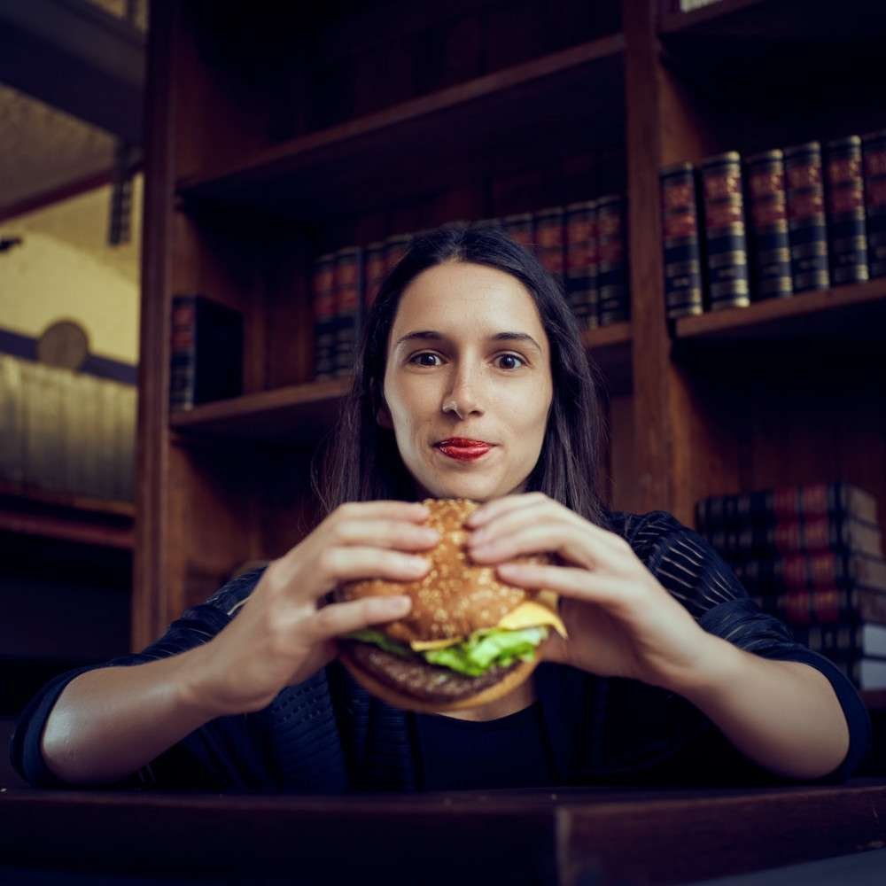 ARE FAT VEGETARIANS HEALTHY? WOMAN HOLDING A BIG SANDWHICH