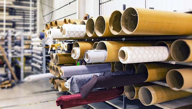 ROLLS OF FABRIC PILED UP - INSIDE THE FASHION INDUSTRY