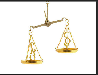 PROS AND CONS - A SCALE OF JUSTICE IS SHOWN