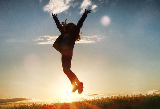 SUCCESS - WOMAN LEAPING FOR JOY