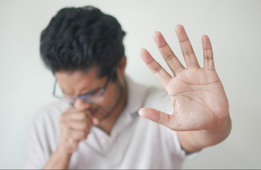 ARE THERE ANY SEDE EFFECTS OF FAT BURNERS - MAN SHOWING HIS PALM AS IF TO SAY STOP WOTH HIS HEAD DOWN
