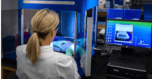 FEMALE GENEOLOGISTS DOING GENETIC RESEARCH IN A LAB