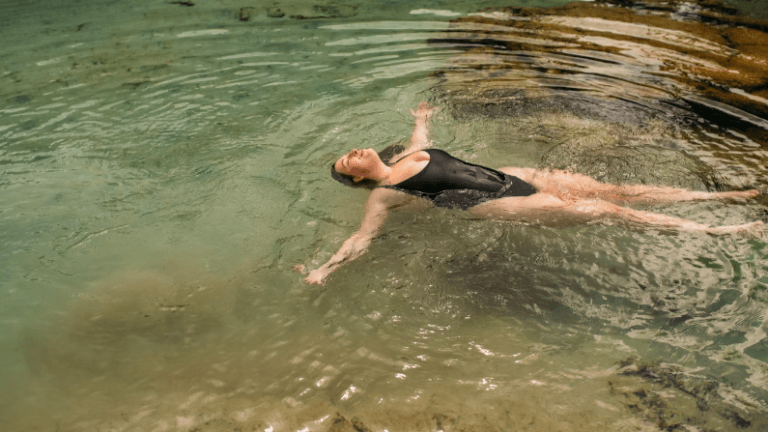 lady floating on her back to prevent heat exhaustion