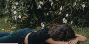 YOUNG GIRL LAYING FACE DOWN ON GROUND FROM HEAT EXHAUSTION