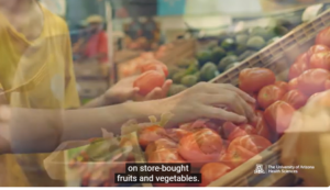 SHOPPER IS SELECTING THEIR PRODUCE AT THE MARKET