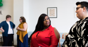 YOUNG ENTREPRENEUR  WEARING  A RED TOP MAY BE MORBIDLY OBES