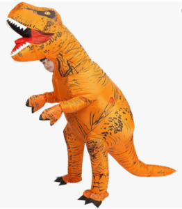 CHILD WEARING A DINOSAUR COSTUME IS INTERESTED FACT FOR HALLOWEEN