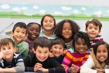 Heal the inner child. A group of mulricultural kids smiling for the camera